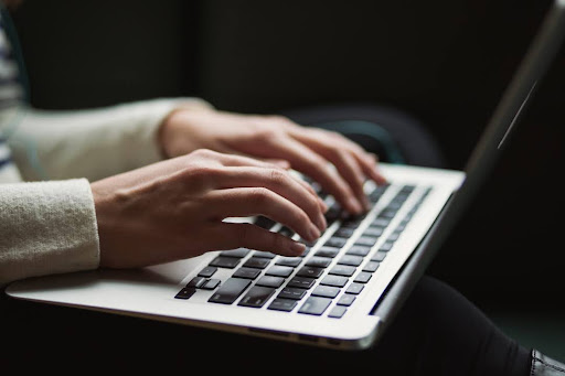 Business professional researching the definition of BANT on a laptop